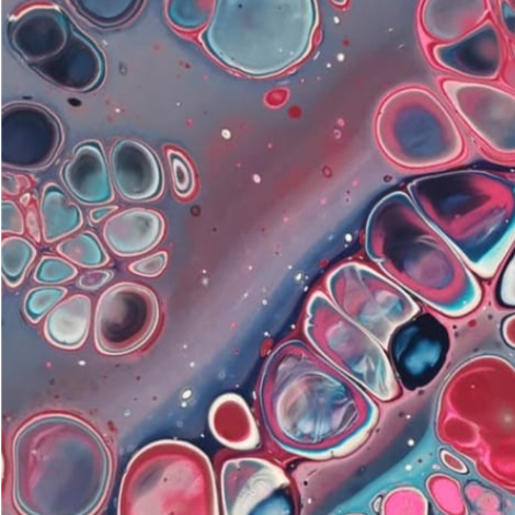 Abstract image of pink, light blue, red, white, and dark blue paint splotches. The splotches are round and some cluster together looking almost like cells under a microscope.