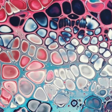 Abstract image covered with lots of circular cell-like shapes in pink, white, teal, dark blue, and red.
